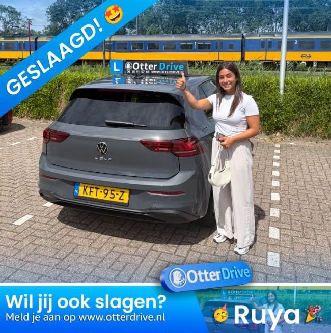 Woman standing beside gray Volkswagen Polo at driving school, holding Otter Drive sign